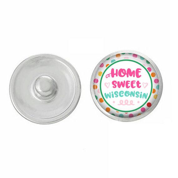 A colorful set of five hand-pressed state-themed snaps, showcasing various state designs, perfect for customizing jewelry.