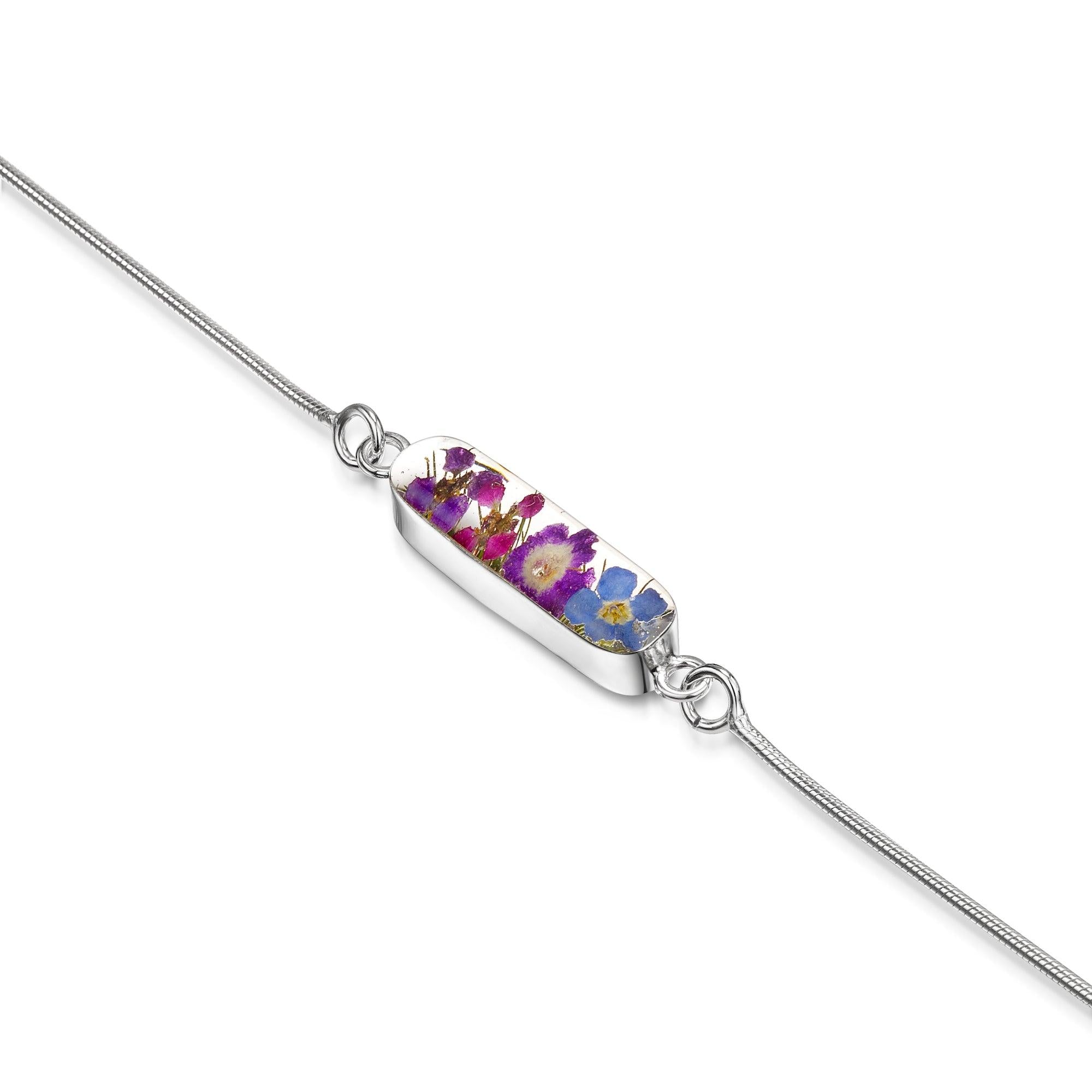 Sterling silver anti-tarnish snake bracelet featuring tiny purple flowers and a flower charm, elegantly displayed in a gift box.