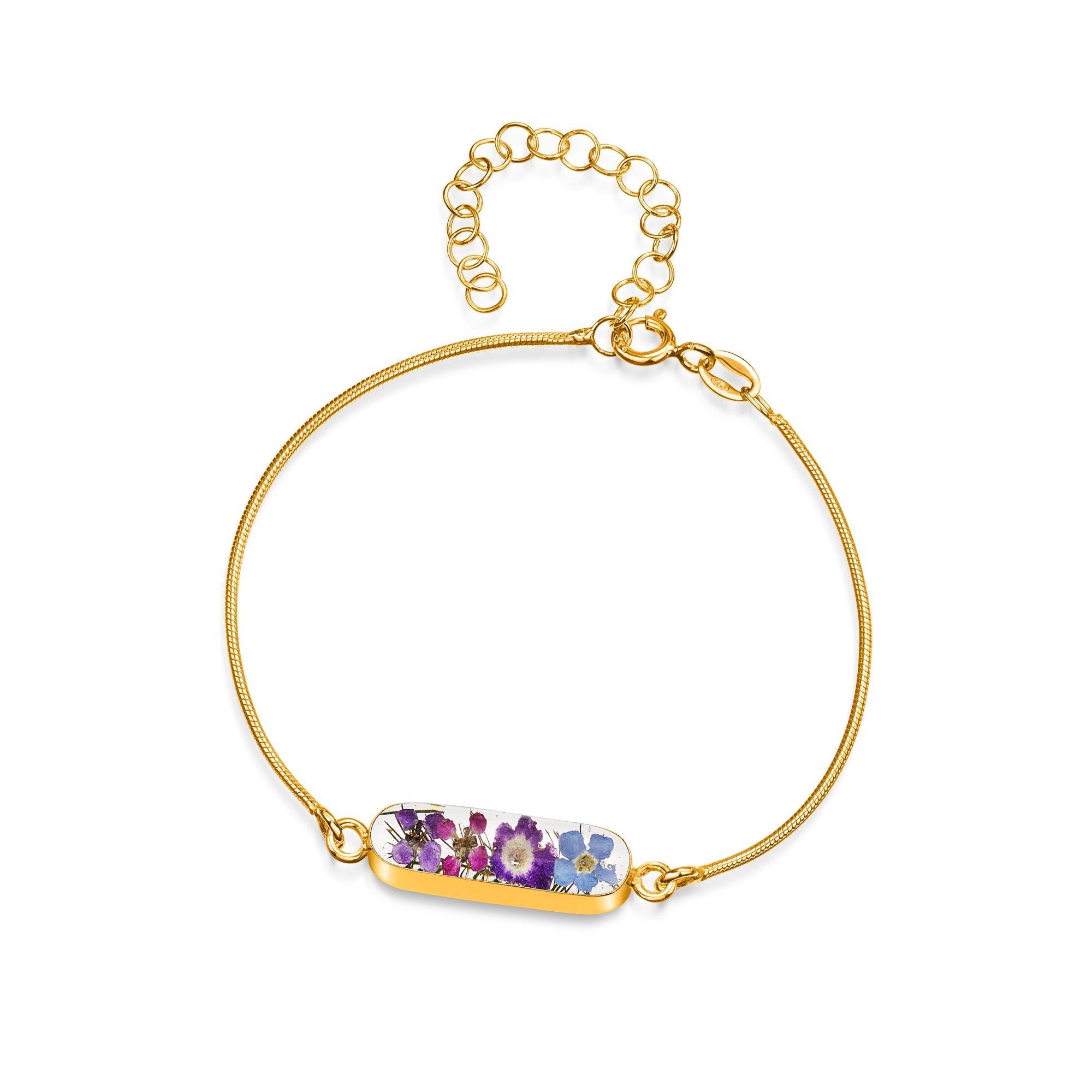 Sterling silver anti-tarnish snake bracelet featuring tiny purple flowers and a flower charm, elegantly displayed in a gift box.