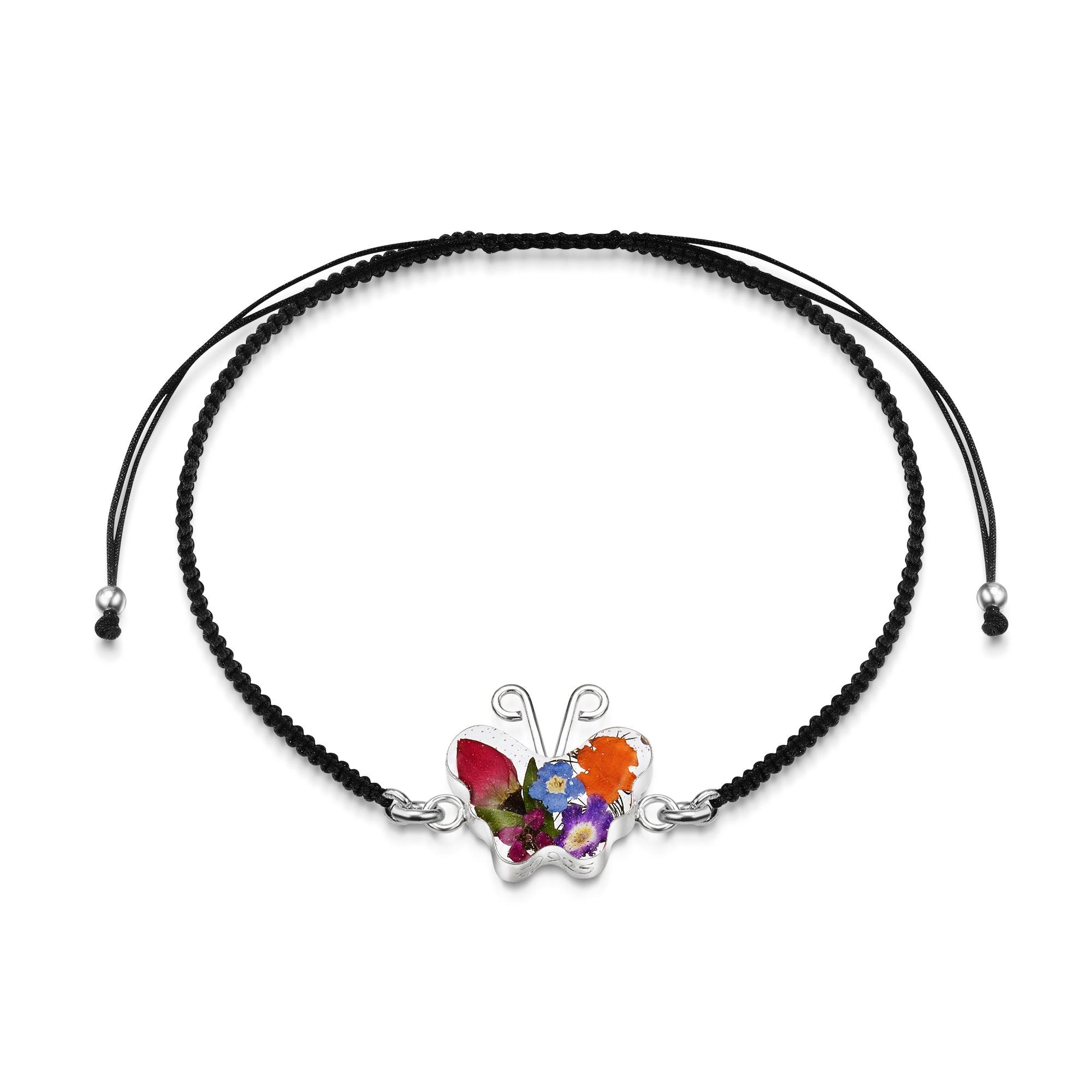 Sterling Silver black woven bracelet featuring a delicate flower charm, showcasing a stylish and elegant design.