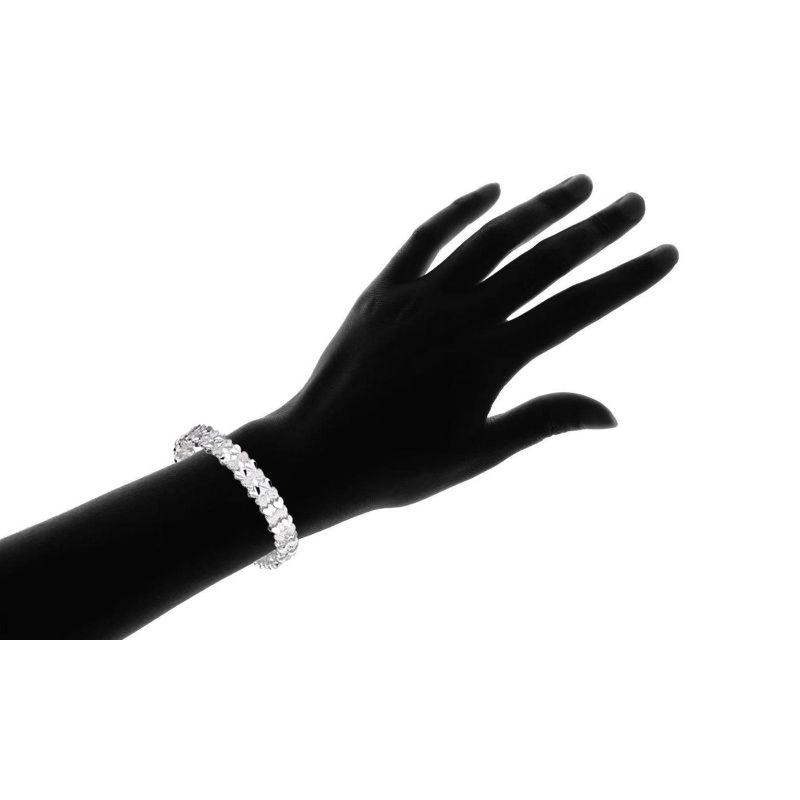 Sterling Silver Diamond-Cut Two Row Heart Bracelet featuring a polished finish and lobster-claw closure, elegantly designed for everyday wear.