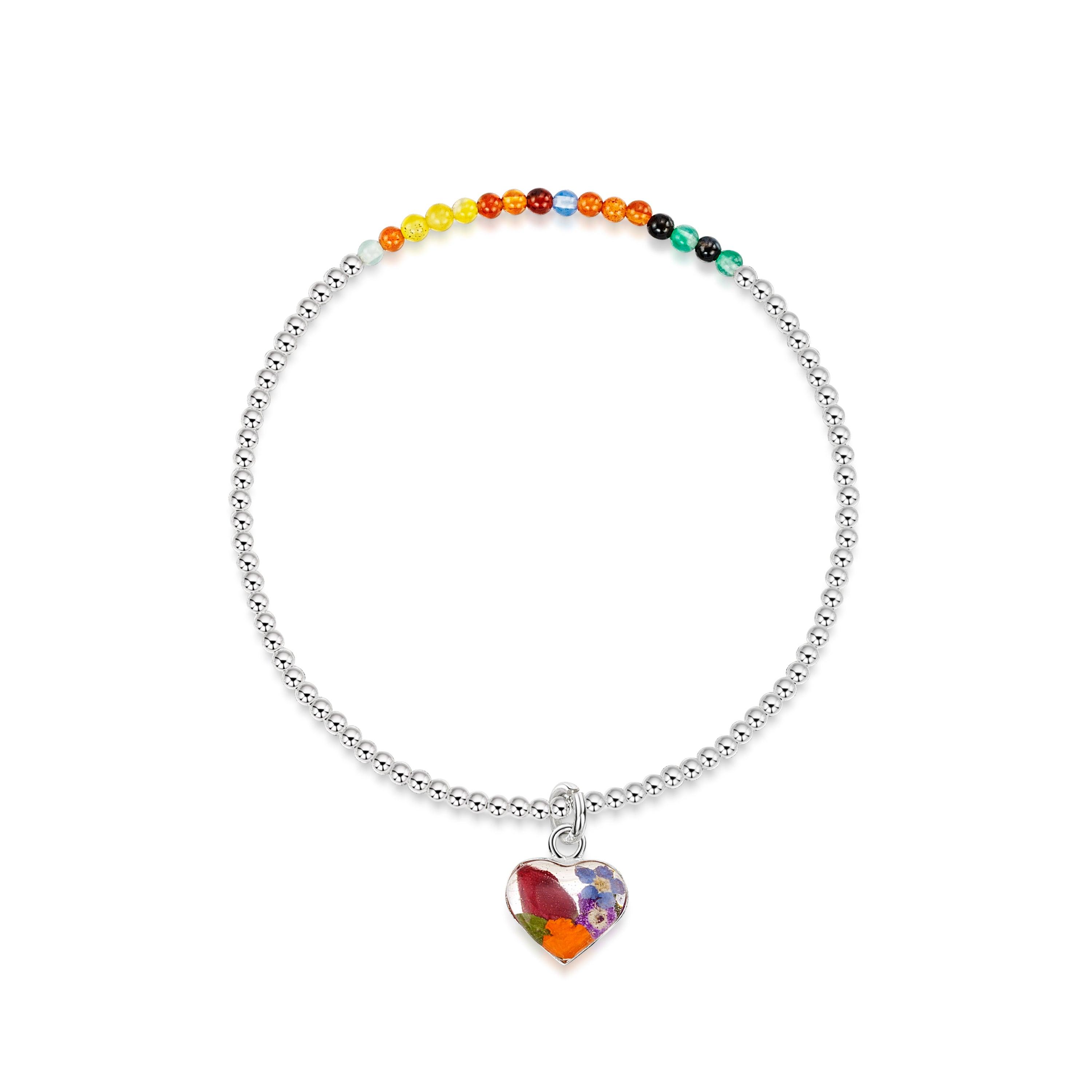 Sterling silver elasticated beaded bracelet featuring mixed agate stones, flowers, and heart accents, showcasing a vibrant and elegant design.