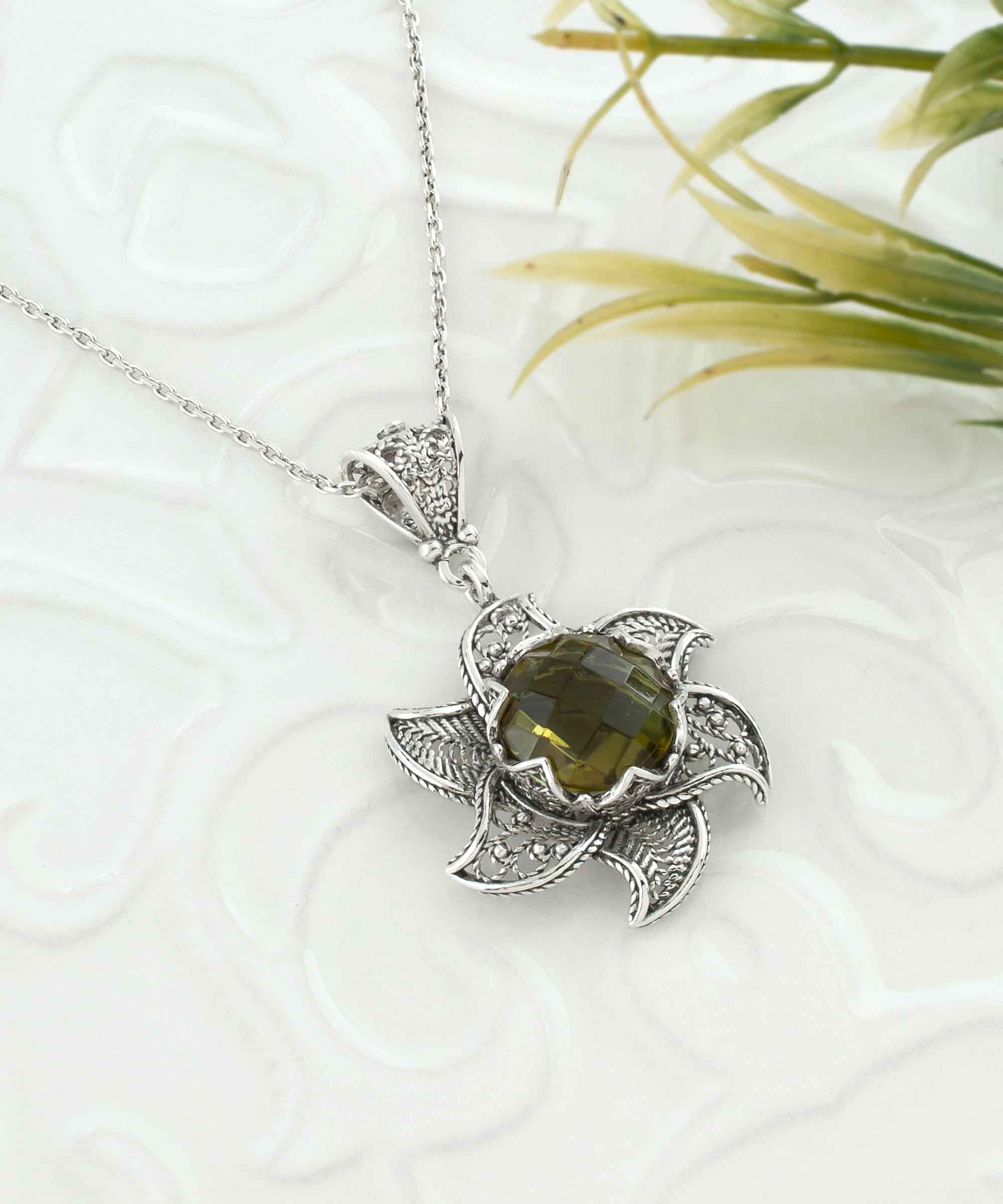 Sterling Silver Filigree Alexandrite Gemstone Blossoming Lotus Flower pendant with intricate design and vibrant gemstone.