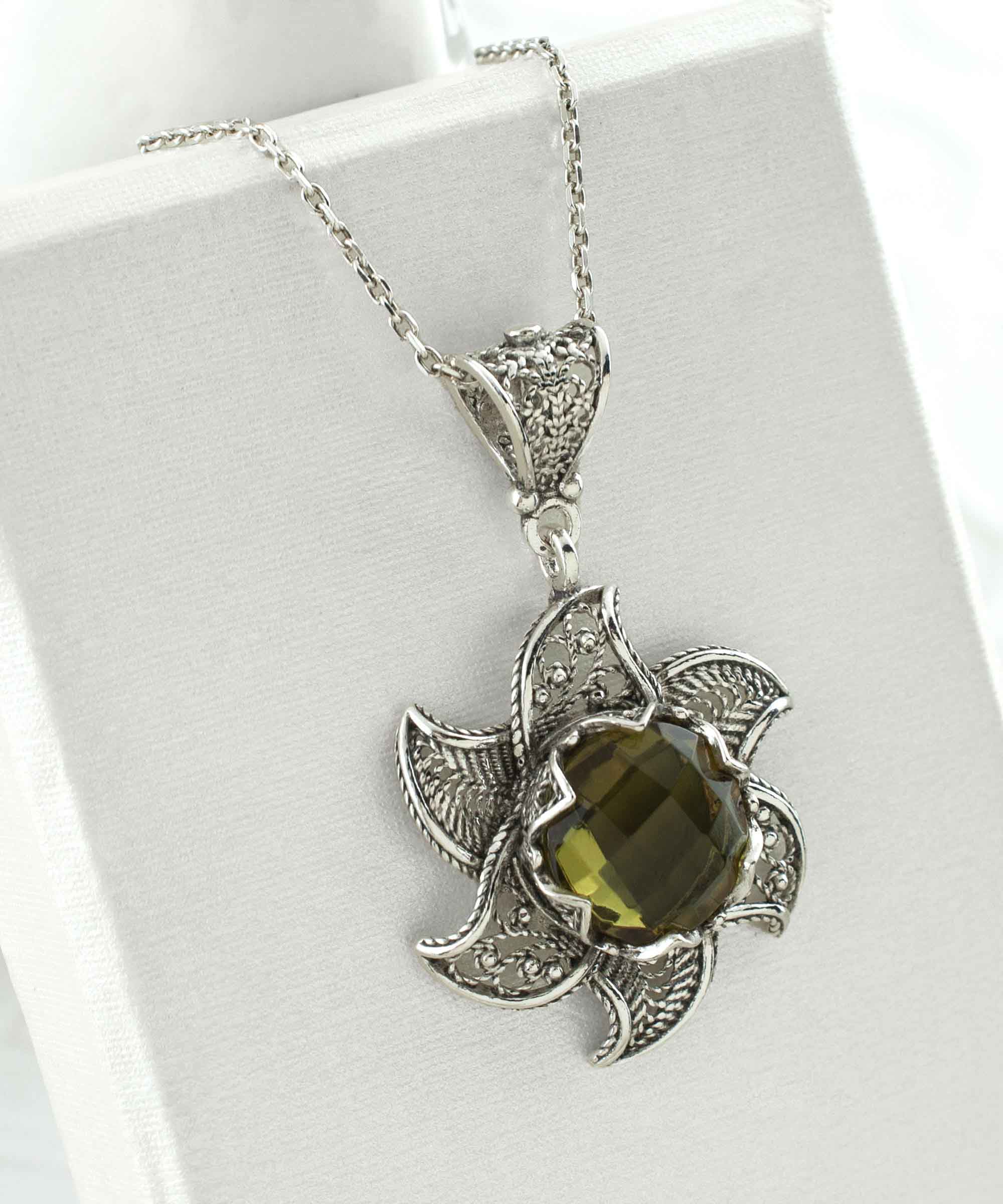 Sterling Silver Filigree Alexandrite Gemstone Blossoming Lotus Flower pendant with intricate design and vibrant gemstone.