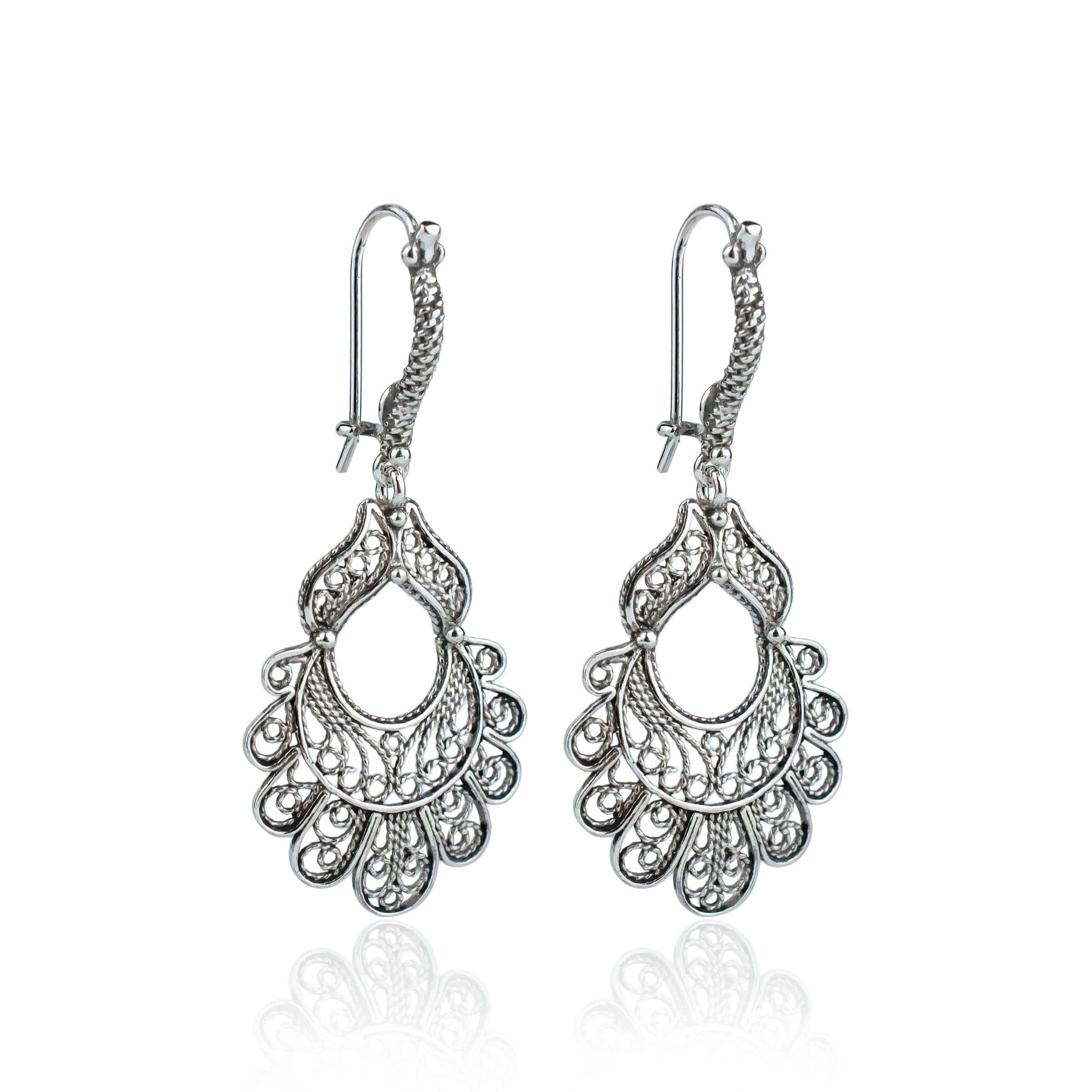 Sterling silver dangle drop earrings featuring an intricate peacock design with filigree detailing, elegantly displayed in a gift box.
