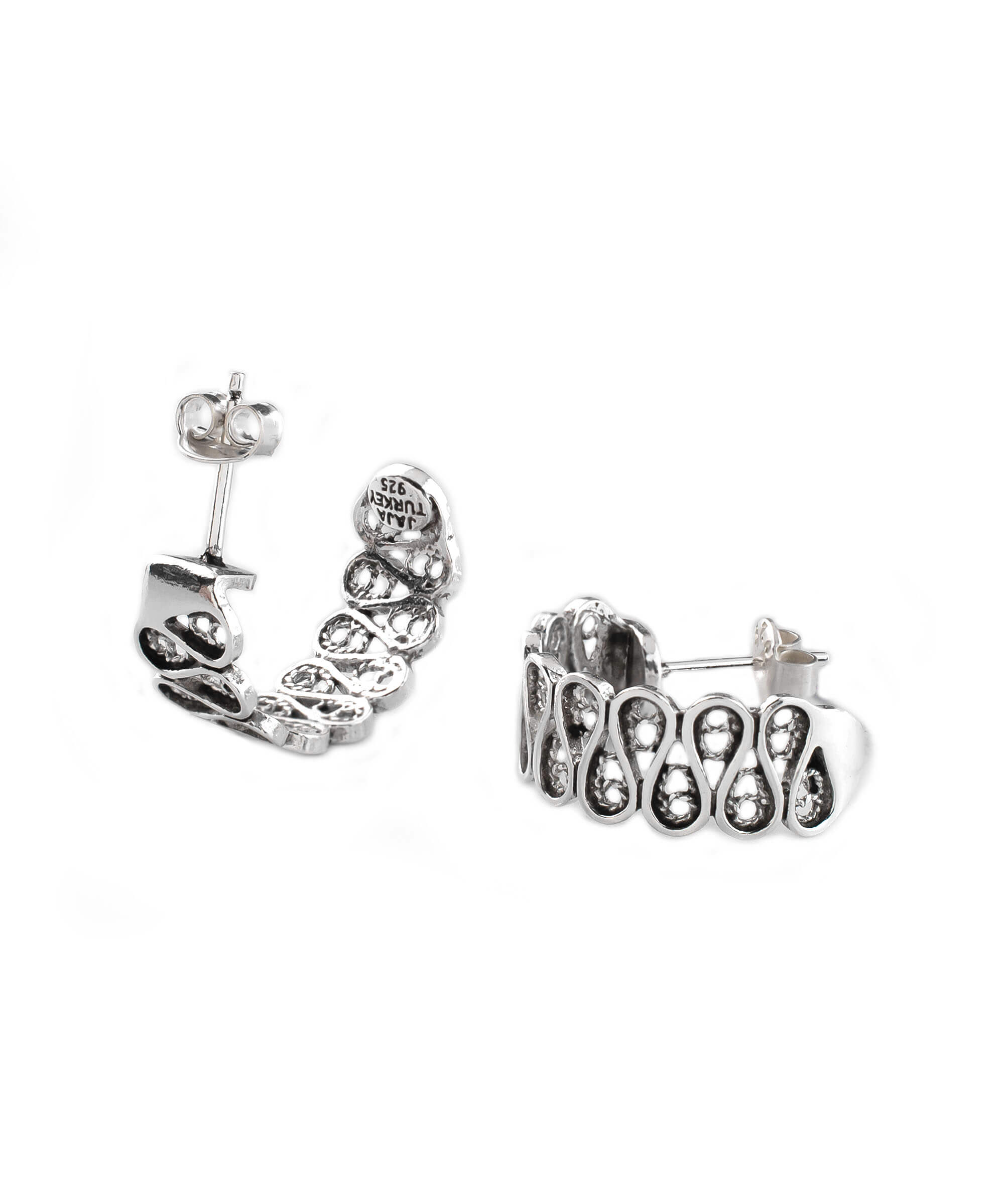 Elegant sterling silver filigree drop earrings with C hoop design, showcasing intricate detailing and polished finish.