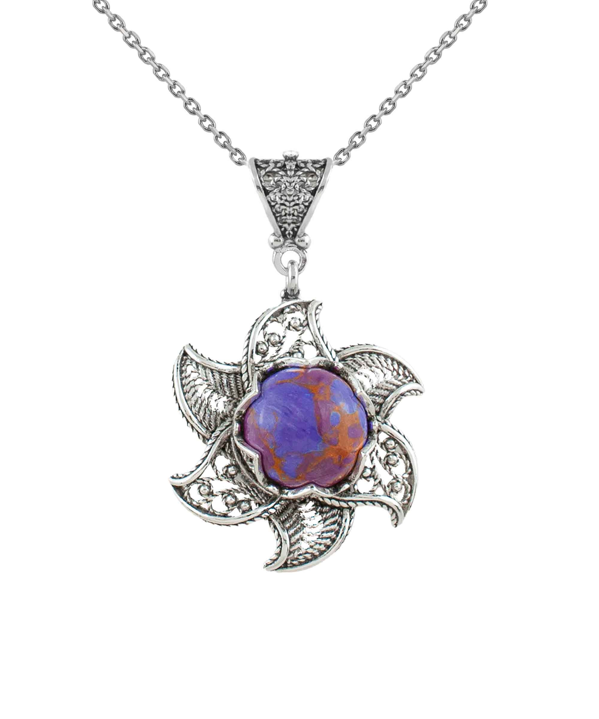 Sterling Silver Filigree necklace featuring a blossoming lotus flower pendant with a mojave turquoise gemstone at the center, elegantly displayed.