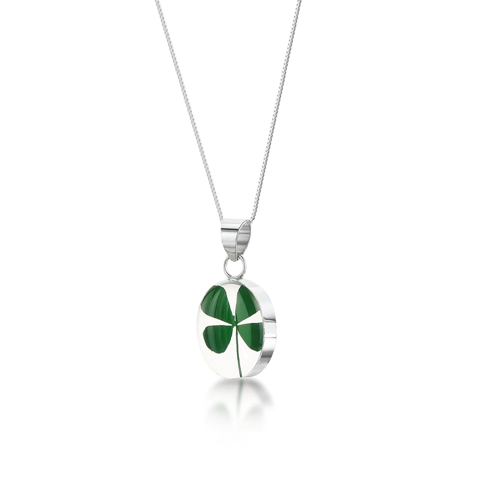 Sterling silver four-leaf clover pendant on a delicate chain, symbolizing good luck and fortune.