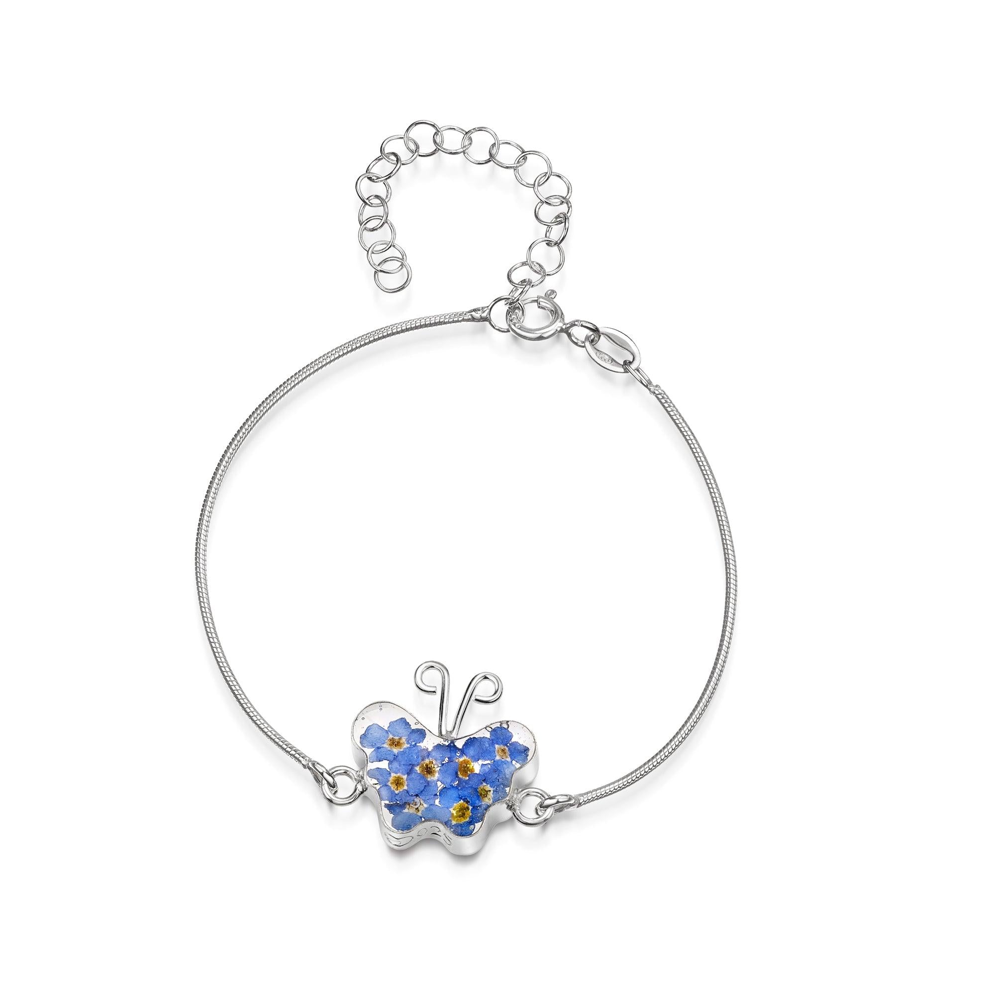 Sterling silver snake bracelet featuring a delicate Forget-me-not flower charm, showcasing its elegant design and rhodium plating.