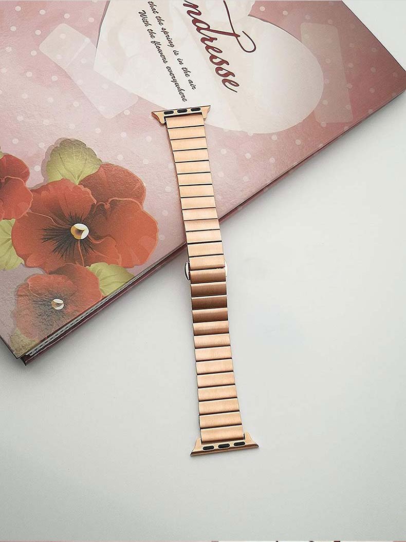 Stainless steel strap for Apple Watch in various colors, showcasing its elegant design and butterfly buckle clasp.