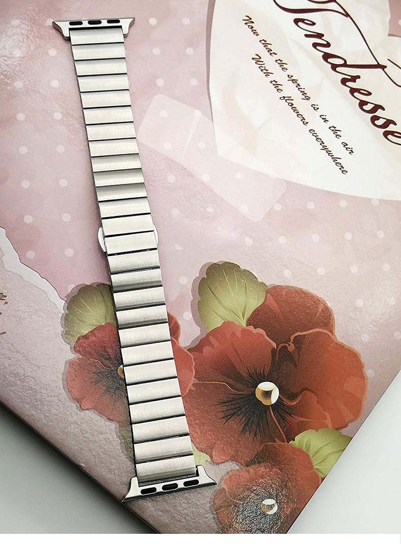 Stainless steel strap for Apple Watch in various colors, showcasing its elegant design and butterfly buckle clasp.