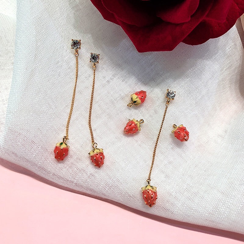 A beautiful assortment of jewelry from the Strawberry Collection, featuring stud earrings, drop earrings, and a pendant necklace, all crafted from alloy and 925 silver.