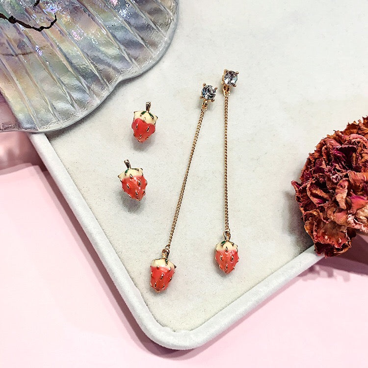 A beautiful assortment of jewelry from the Strawberry Collection, featuring stud earrings, drop earrings, and a pendant necklace, all crafted from alloy and 925 silver.