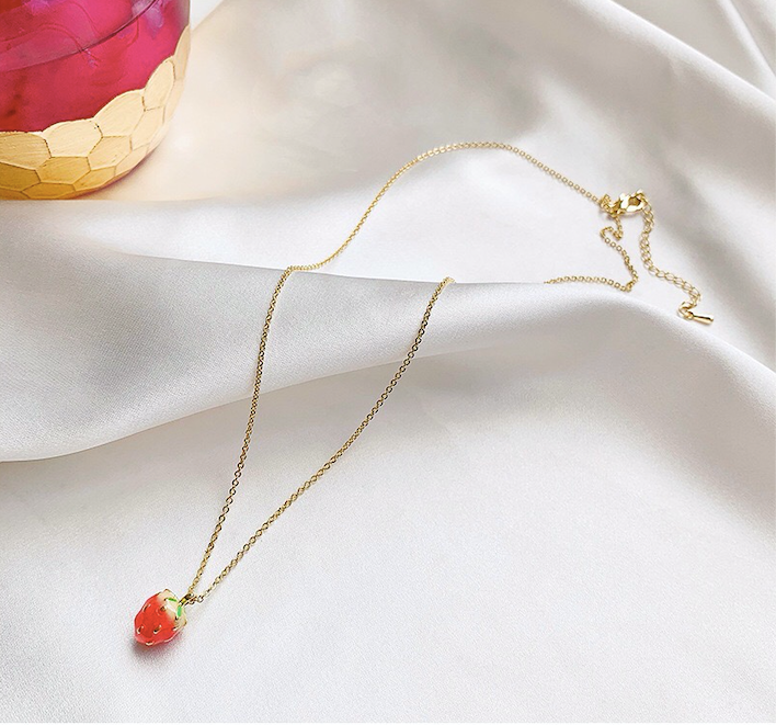 A beautiful assortment of jewelry from the Strawberry Collection, featuring stud earrings, drop earrings, and a pendant necklace, all crafted from alloy and 925 silver.