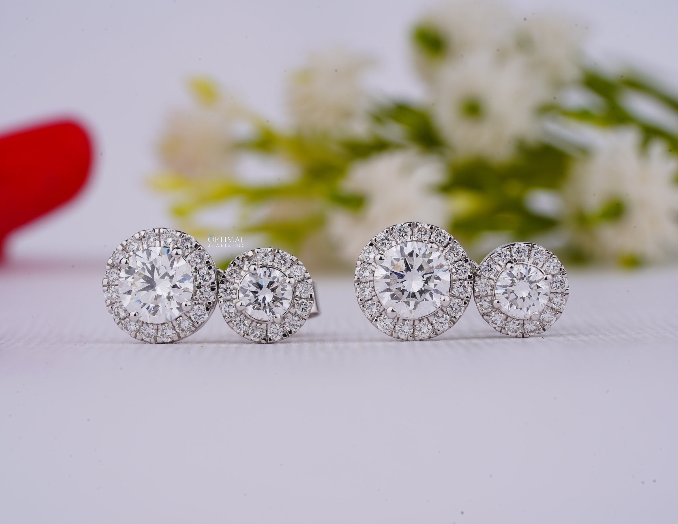 Stunning Double Halo Lab Diamond Earrings featuring 2.50 Ctw IGI Certified round cut diamonds in an elegant design.