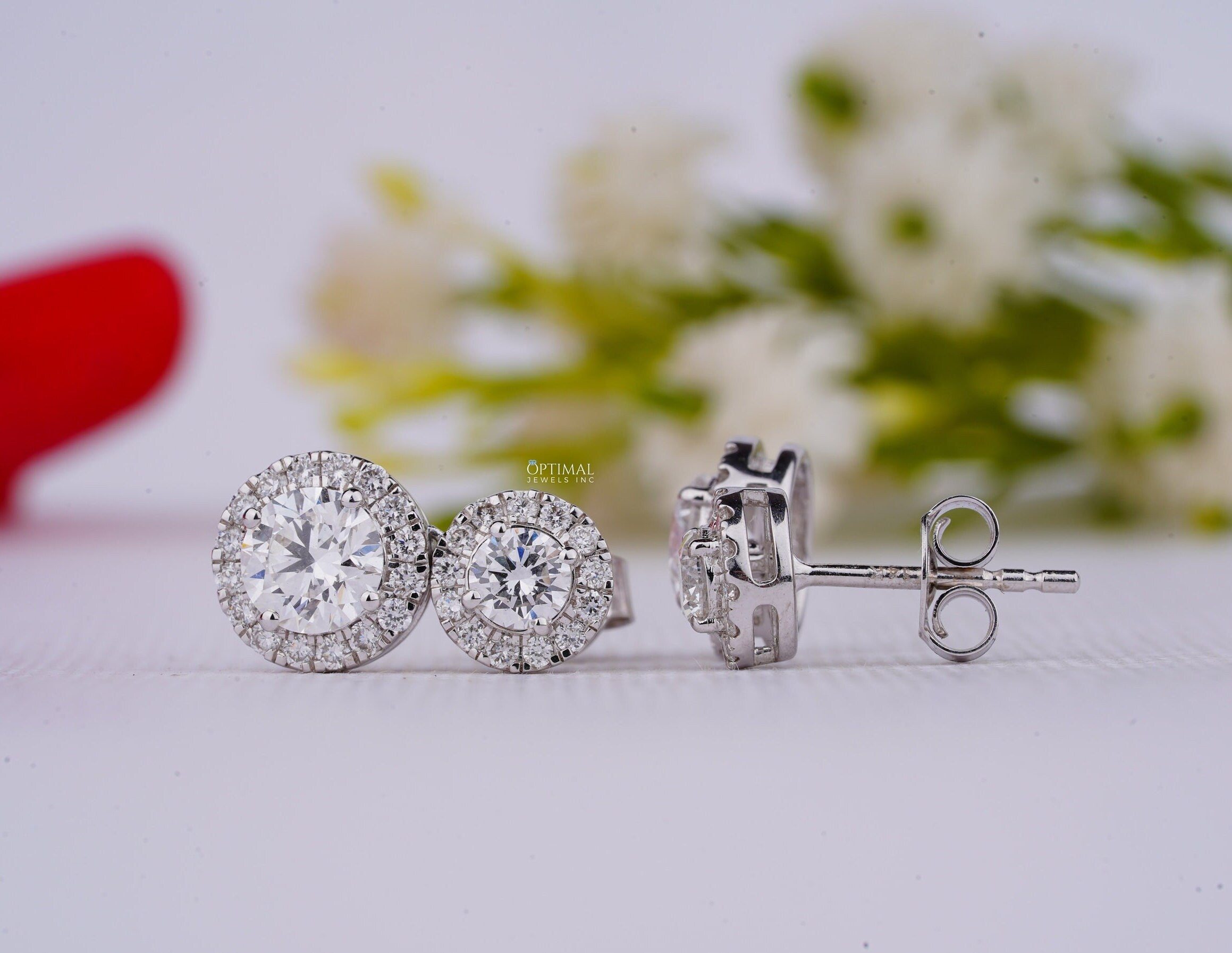 Stunning Double Halo Lab Diamond Earrings featuring 2.50 Ctw IGI Certified round cut diamonds in an elegant design.