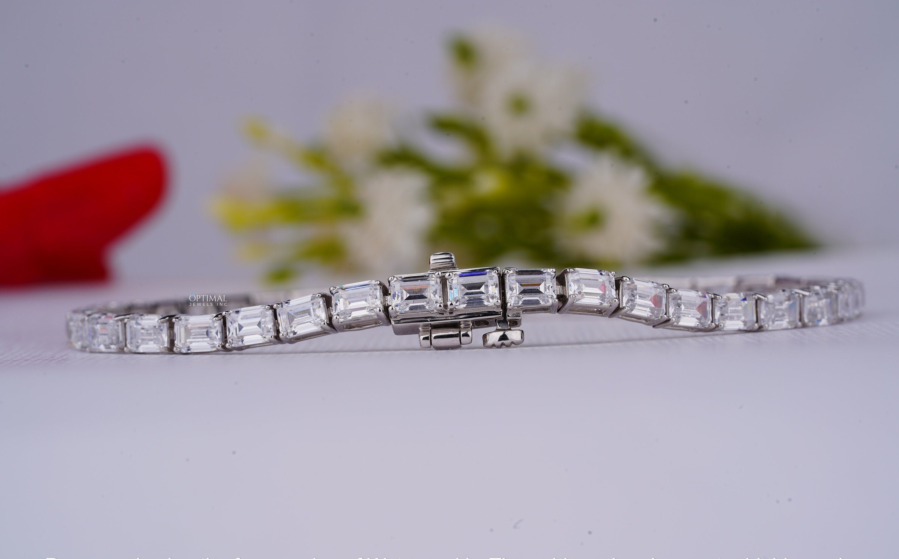 Stunning emerald cut lab grown diamond tennis bracelet in white gold, featuring 8.00 CTW of sparkling diamonds.