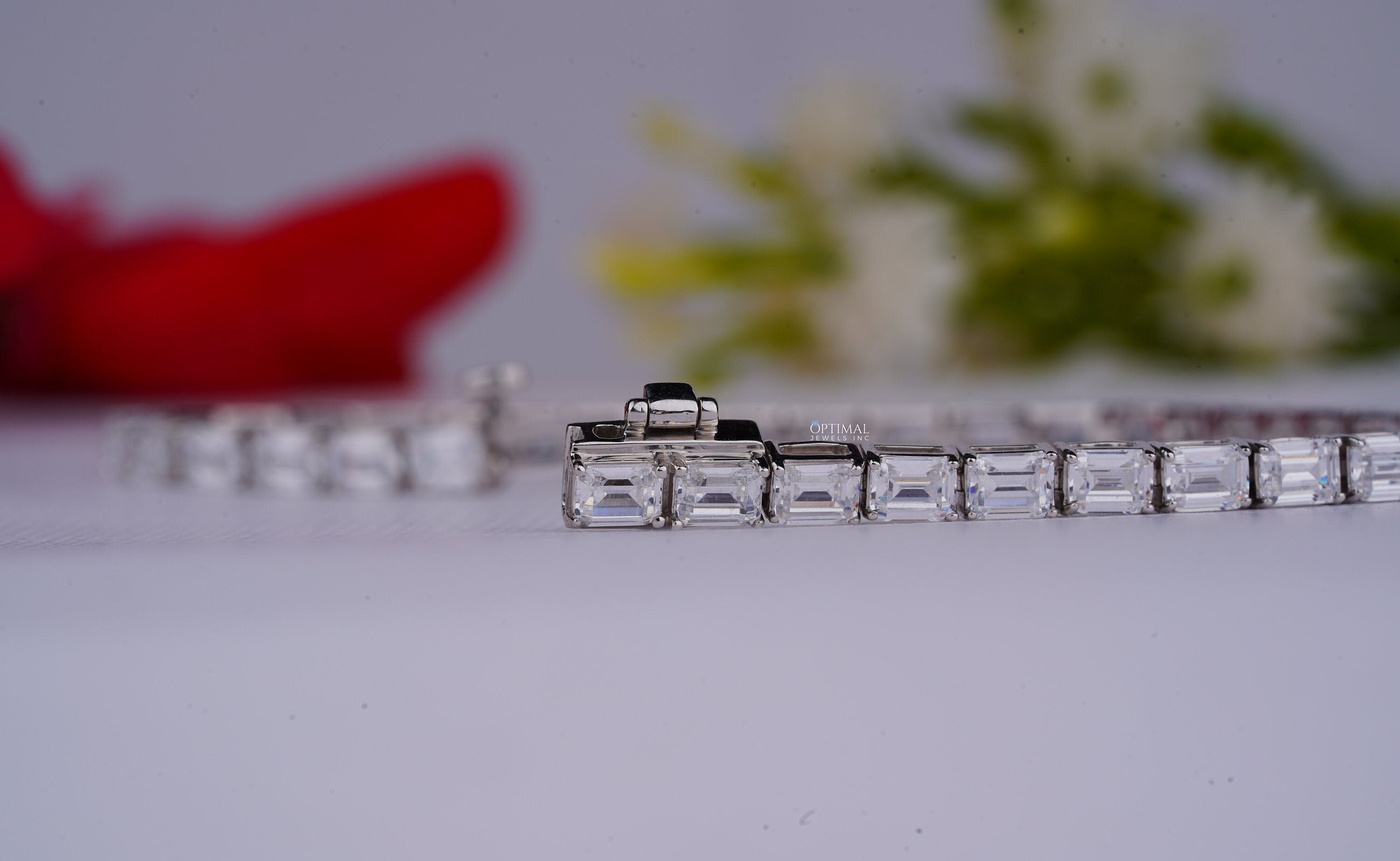 Stunning emerald cut lab grown diamond tennis bracelet in white gold, featuring 8.00 CTW of sparkling diamonds.