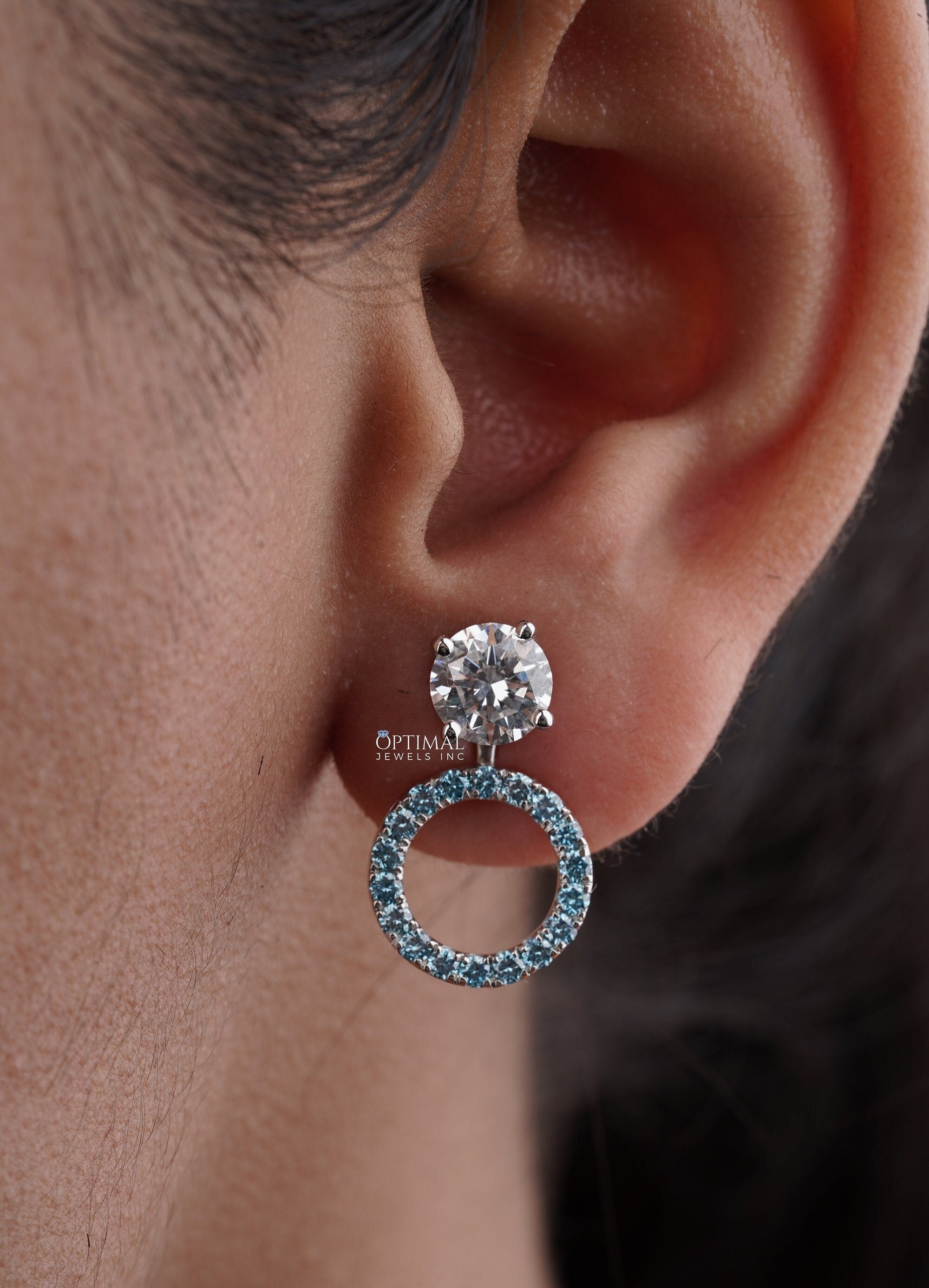 Stunning Round Halo Stud Earring featuring 2.44 Ctw Blue Sapphire in a pave setting, crafted in white gold with lab-grown diamonds.