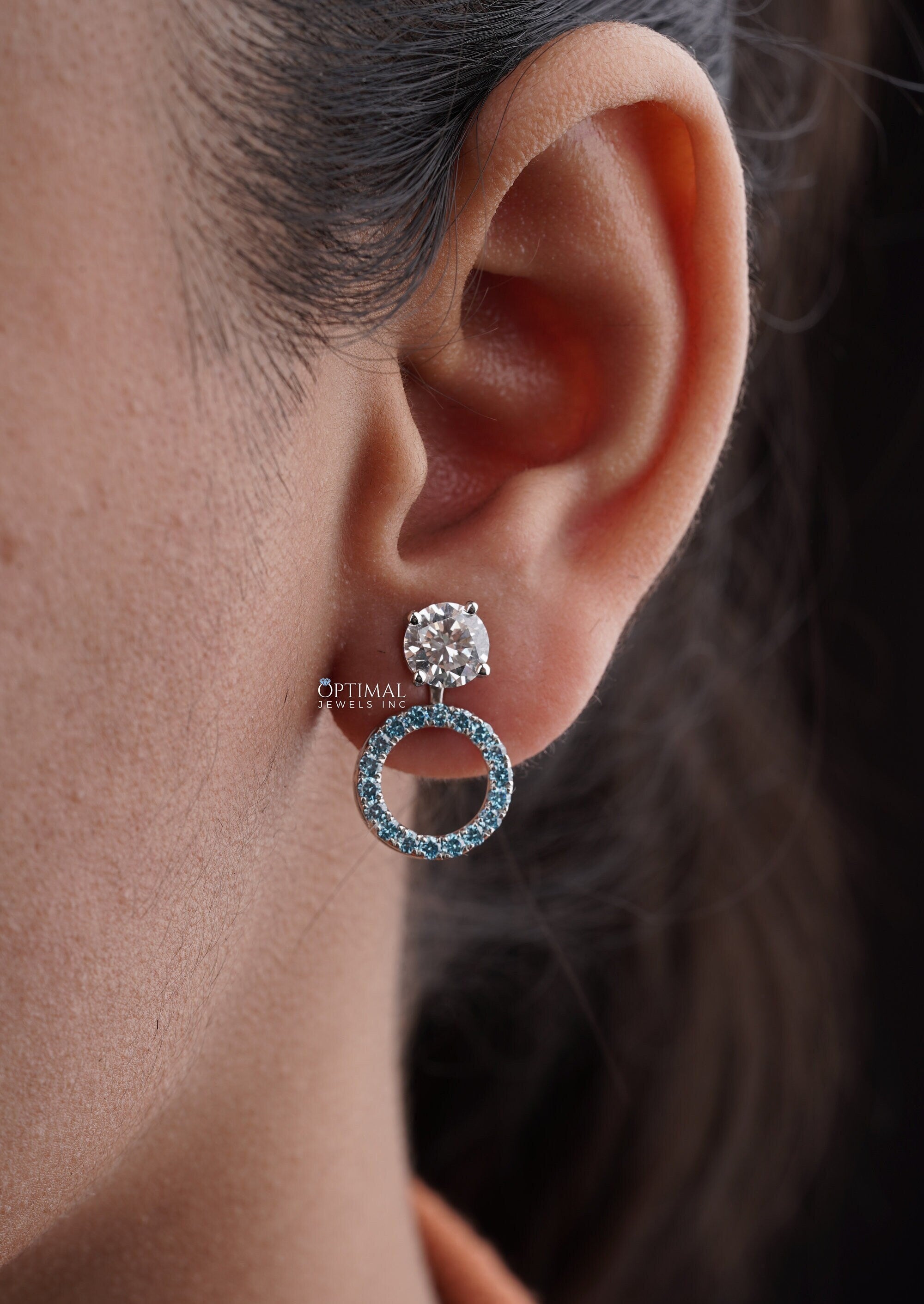 Stunning Round Halo Stud Earring featuring 2.44 Ctw Blue Sapphire in a pave setting, crafted in white gold with lab-grown diamonds.