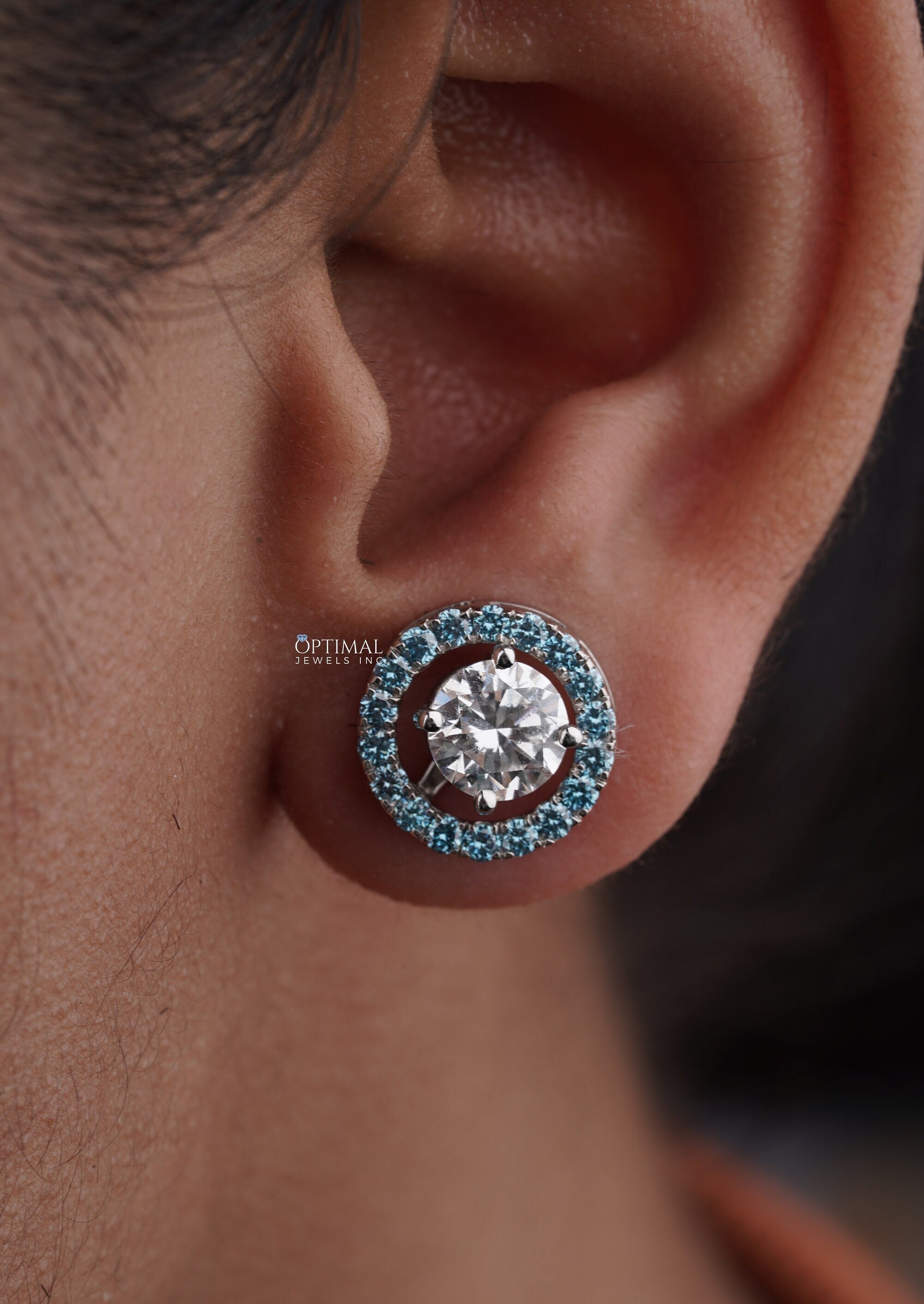Stunning Round Halo Stud Earring featuring 2.44 Ctw Blue Sapphire in a pave setting, crafted in white gold with lab-grown diamonds.
