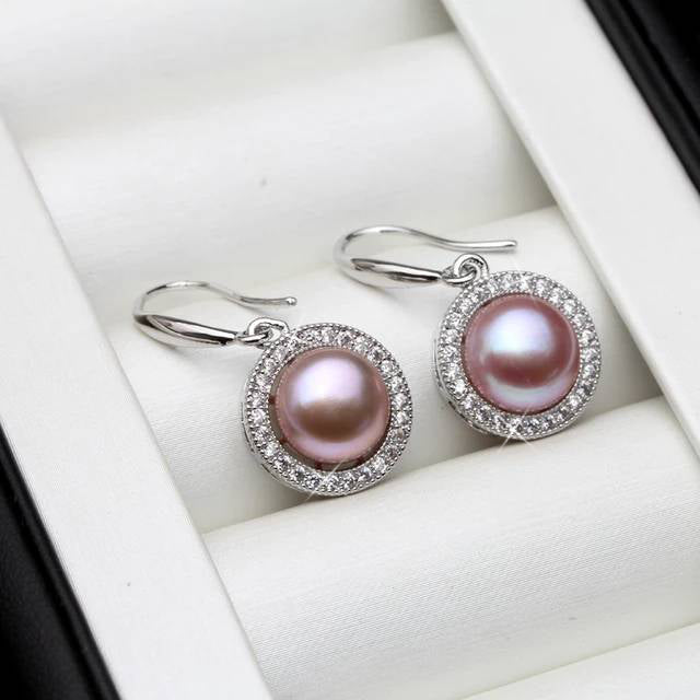A pair of stunning drop earrings featuring genuine freshwater pearls in various colors, adorned with simulated diamonds for added elegance.