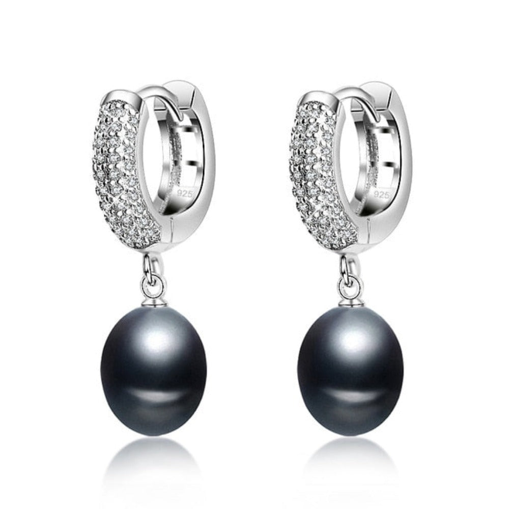 A pair of stunning drop earrings featuring simulated diamonds and genuine freshwater pearls in various colors.
