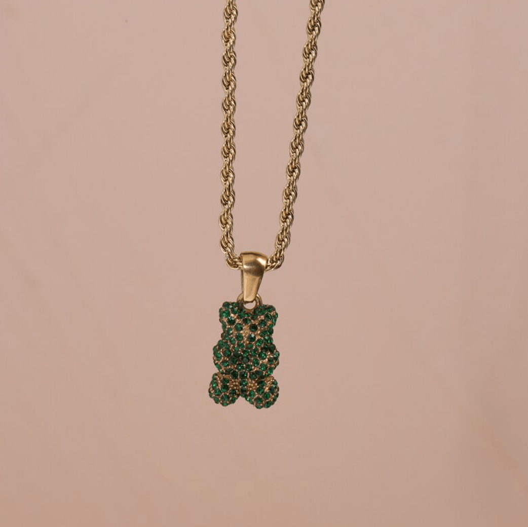 Tam Encrusted Teddy Bear Sparkle Charm Necklace featuring a teddy bear charm with sparkling crystals on a gold rope chain.