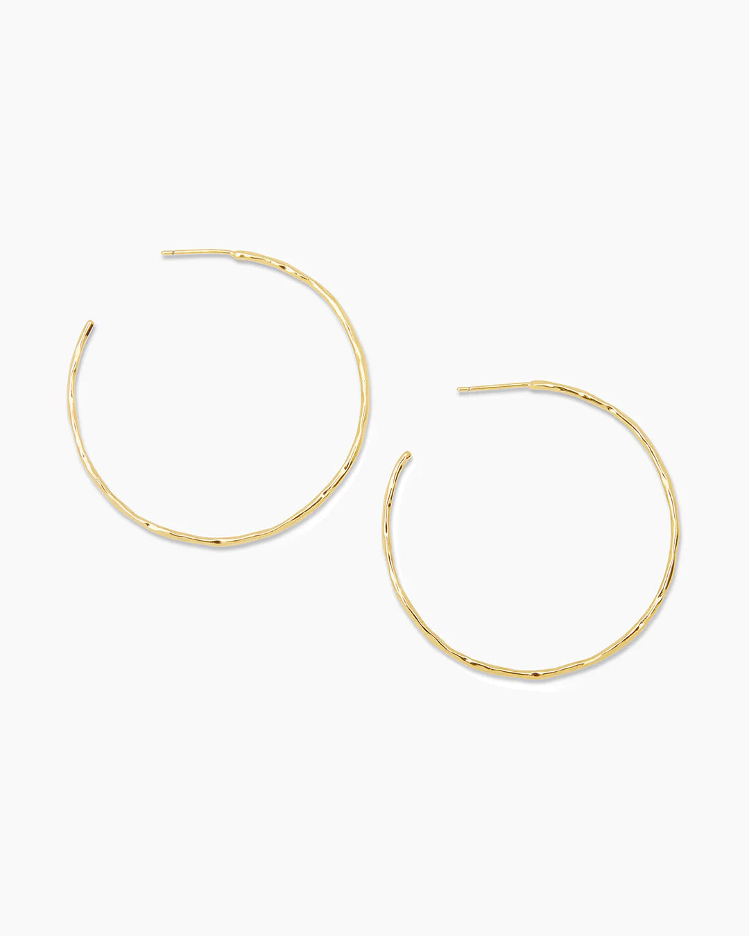 A pair of Taner Hoops showcasing their sleek and sophisticated design, handcrafted with high-quality materials.