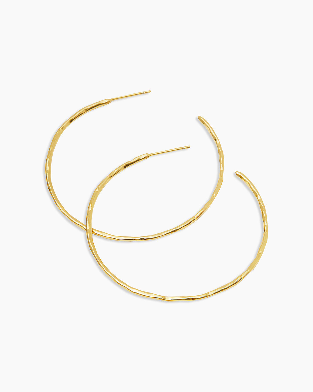 A pair of Taner Hoops showcasing their sleek and sophisticated design, handcrafted with high-quality materials.