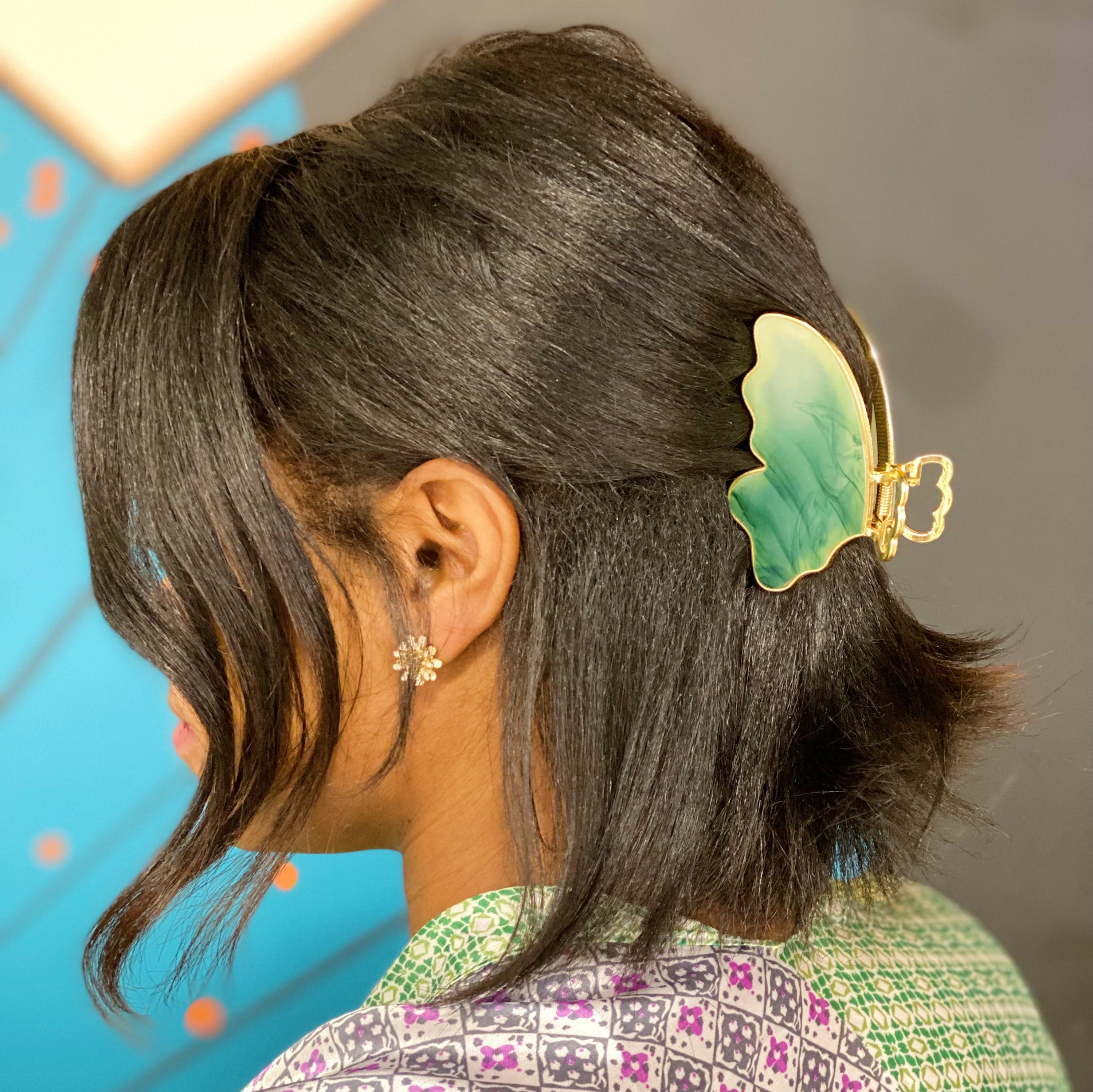 Taylor Butterfly Hair Claw featuring a beautiful butterfly design in resin and metal, perfect for securing hair stylishly.