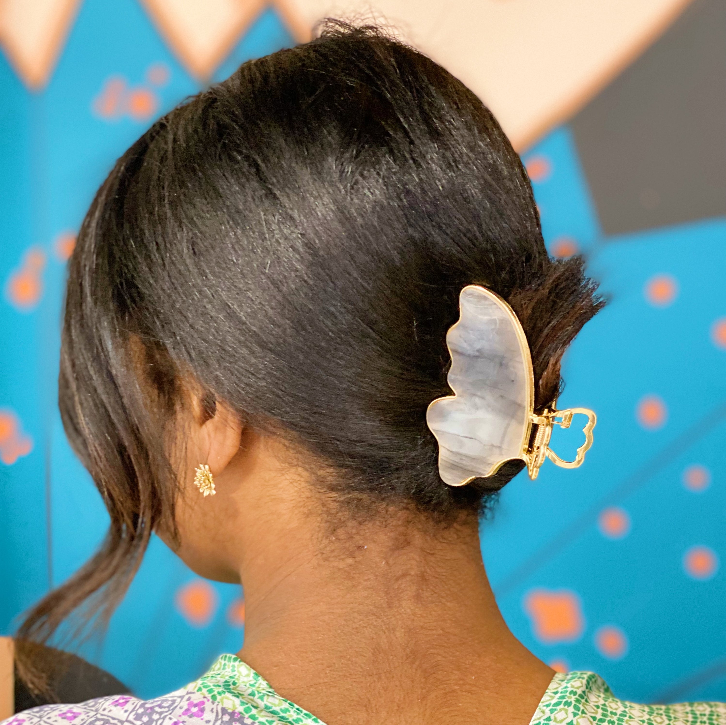 Taylor Butterfly Hair Claw featuring a beautiful butterfly design in resin and metal, perfect for securing hair stylishly.