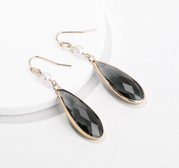 A pair of elegant Tear Drop Stone Hook Earrings by DOBBI, showcasing a beautiful glass design in various colors, perfect for summer wear.