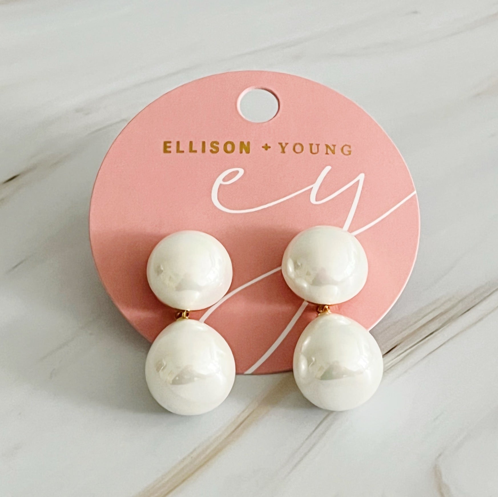 Elegant teardrop pearl earrings featuring lustrous glass pearls and 18k gold plated brass setting, perfect for any occasion.