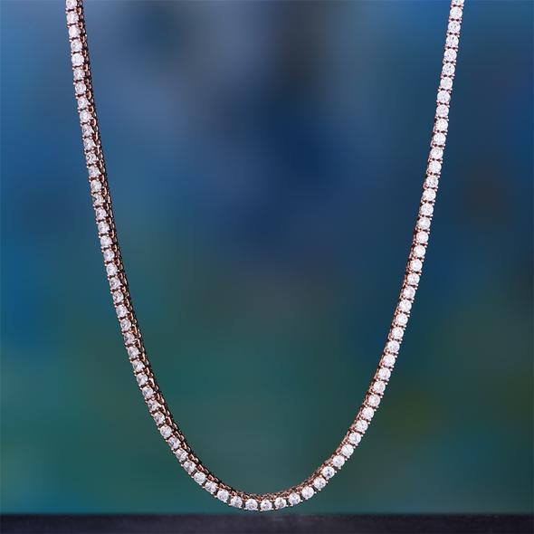 Elegant Tennis Necklace and Princess Halo Earring Set in 18K rose gold with Austrian crystals, displayed in a luxe gift box.
