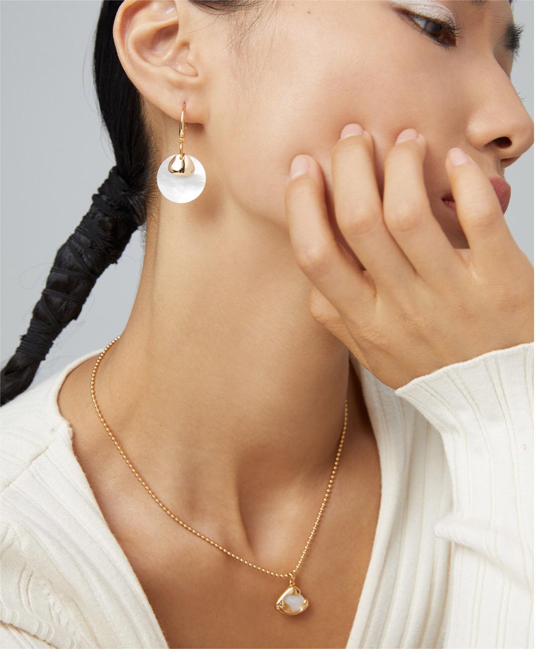 Ethereal Mother-of-Pearl Skirt Pendant Necklace featuring a gold vermeil chain and a stunning mother-of-pearl pendant.