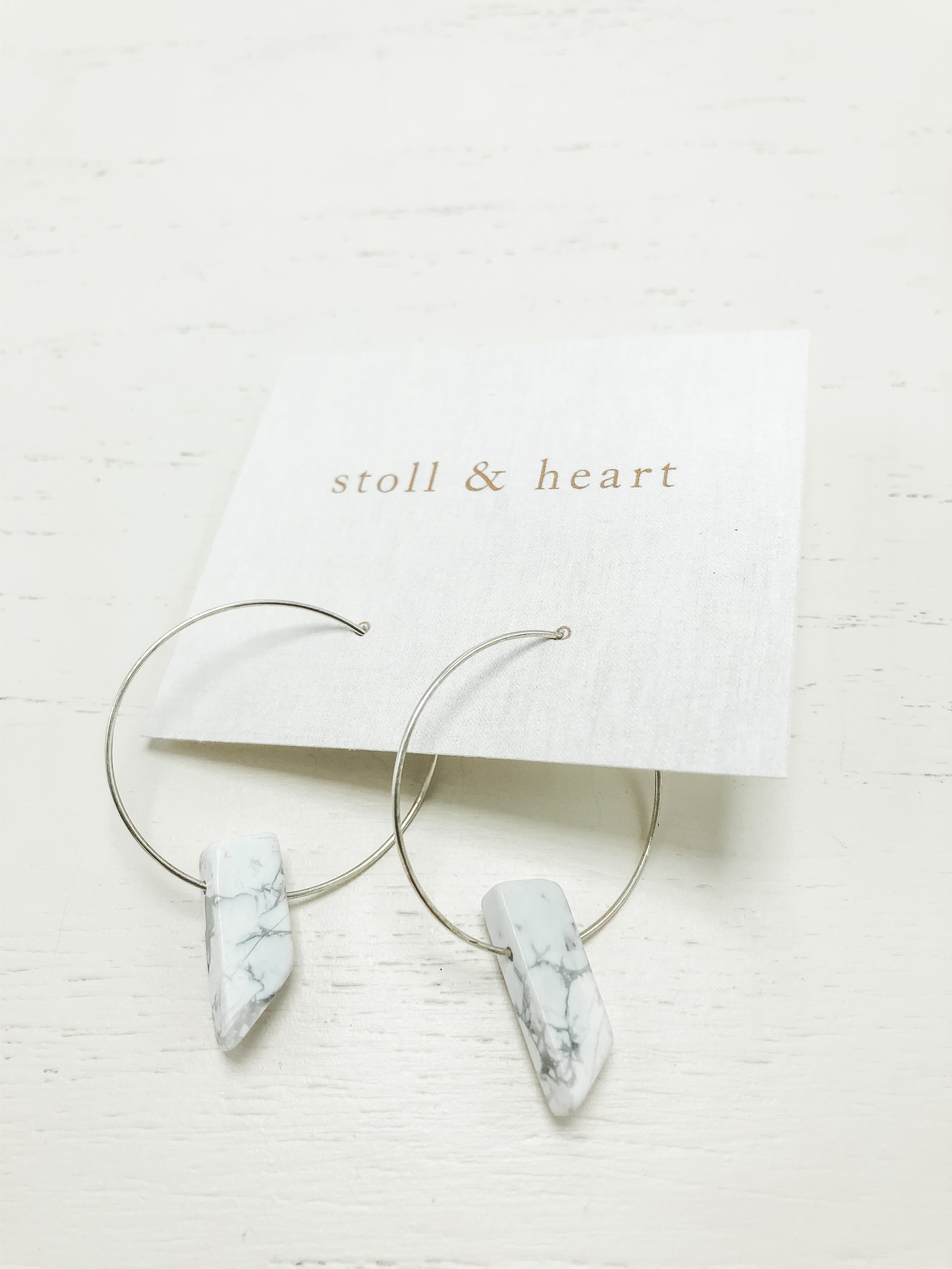 The Henley Howlite - Silver earrings featuring sterling silver hoops and calming howlite stones, elegantly designed for stylish wear.