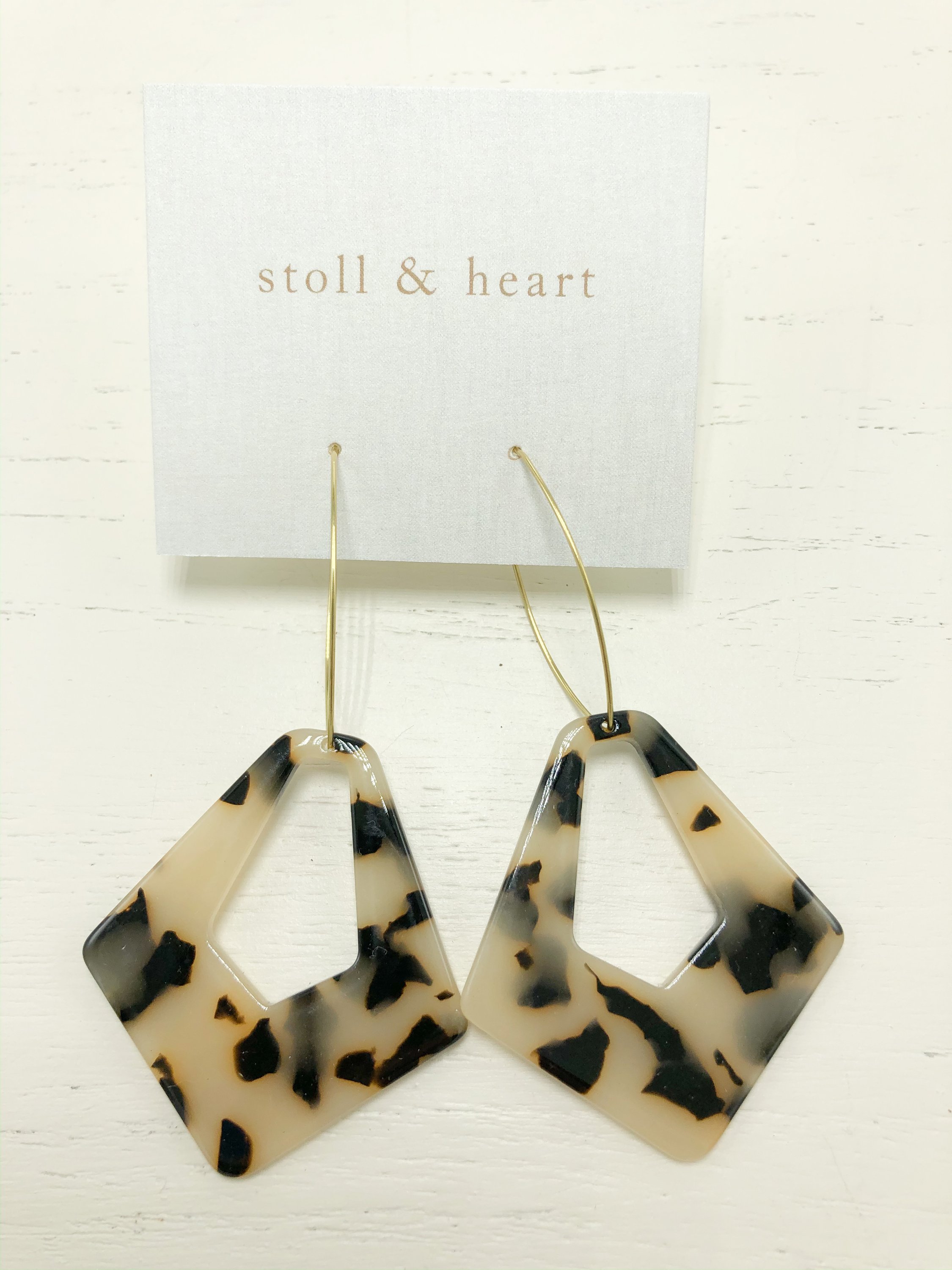 The Madison Light Tortoise earrings featuring brass hoops and light tortoise resin details, measuring approximately 3 inches in length.