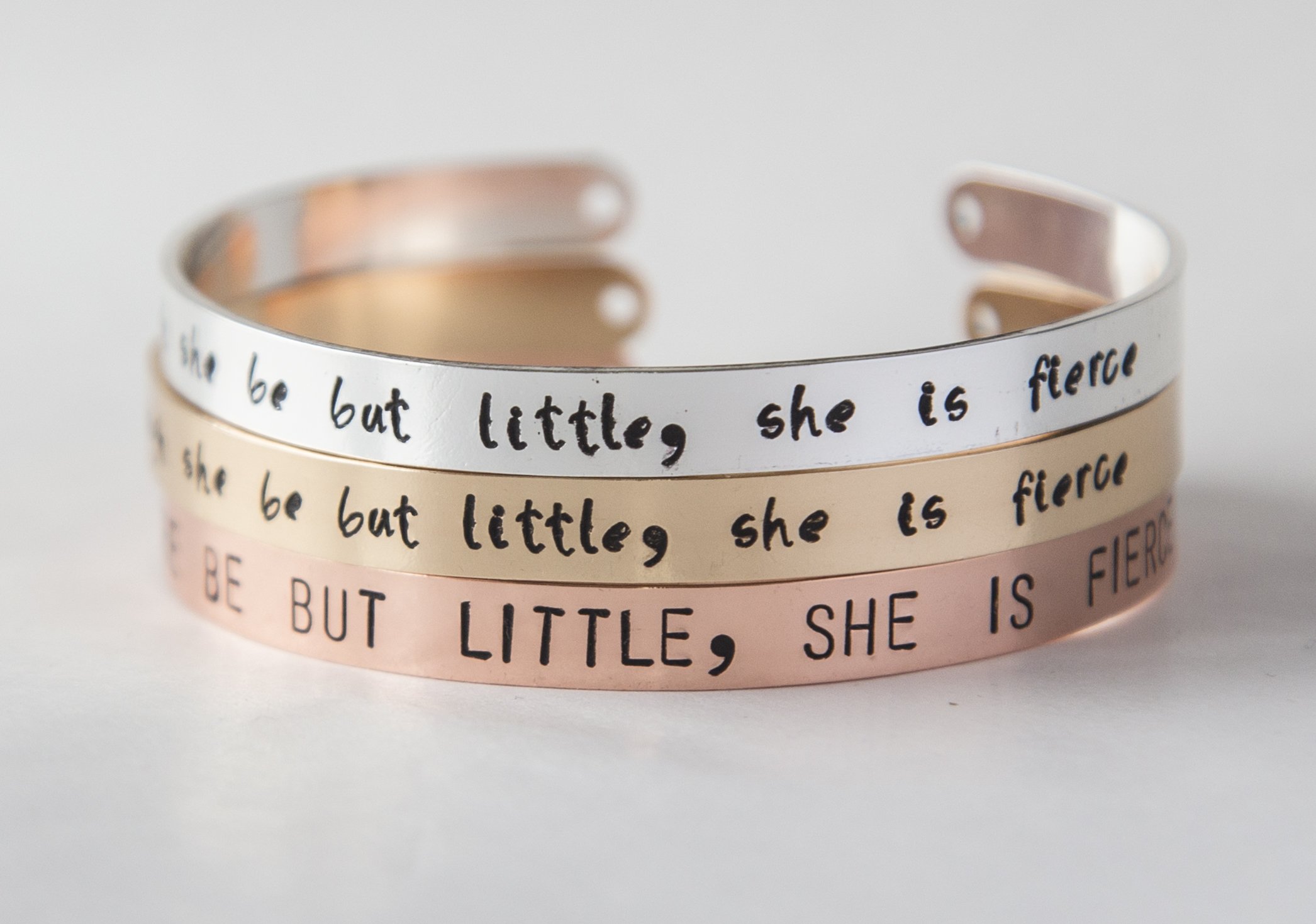 A beautifully crafted bracelet with the inscription 'Though She Be But Little, She is Fierce', available in silver and gold plating.