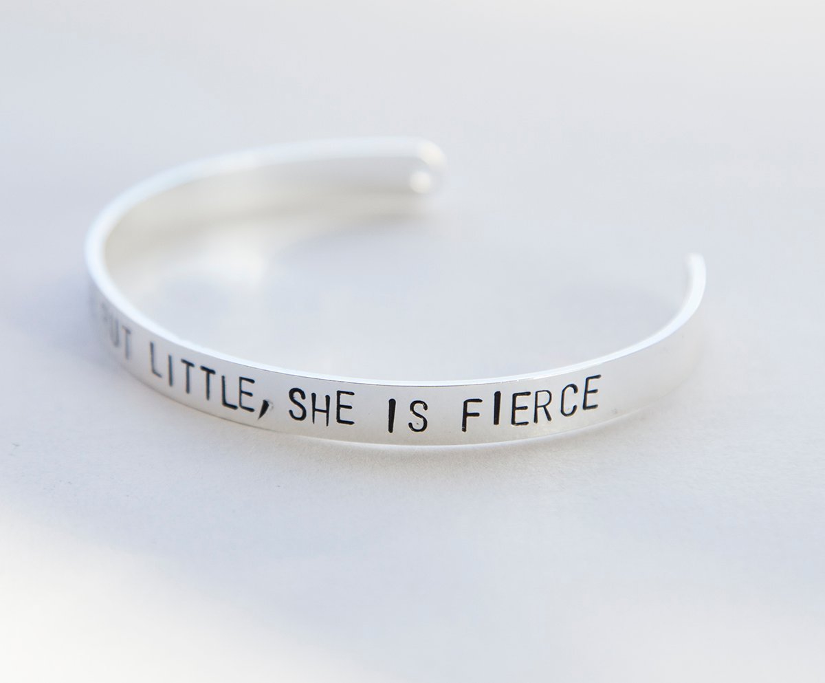 A beautifully crafted bracelet with the inscription 'Though She Be But Little, She is Fierce', available in silver and gold plating.