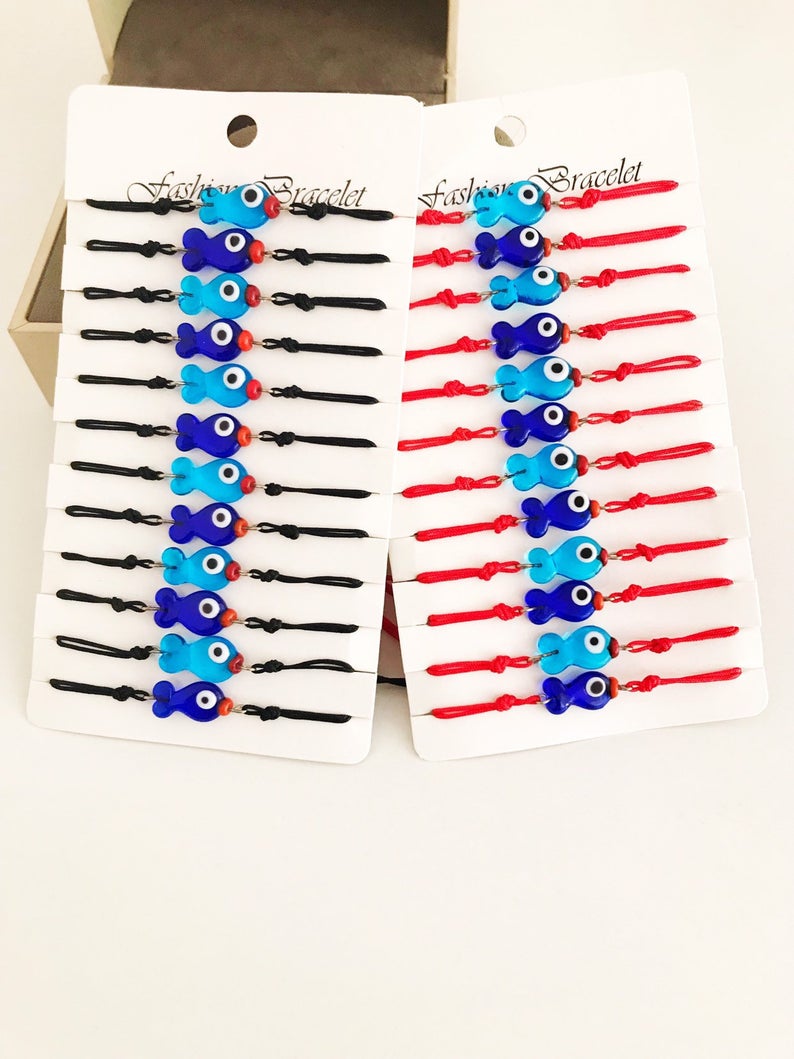 Handmade Thread Evil Eye Bracelet featuring Murano glass fish charm in turquoise and blue colors, adjustable thread design.