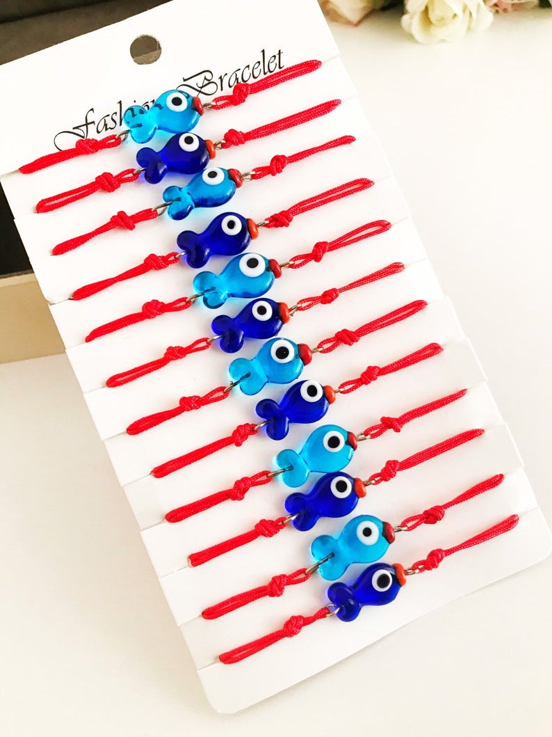 Handmade Thread Evil Eye Bracelet featuring Murano glass fish charm in turquoise and blue colors, adjustable thread design.