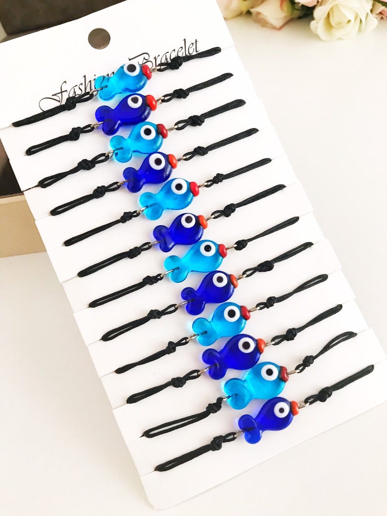 Handmade Thread Evil Eye Bracelet featuring Murano glass fish charm in turquoise and blue colors, adjustable thread design.
