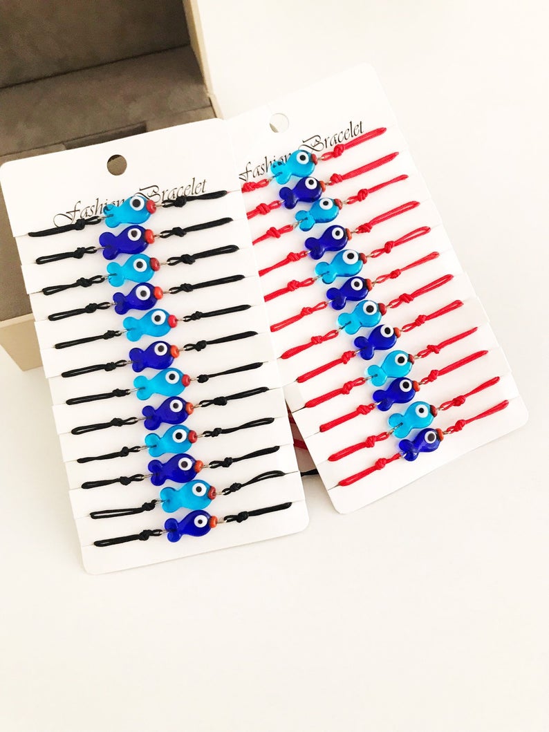 Handmade Thread Evil Eye Bracelet featuring Murano glass fish charm in turquoise and blue colors, adjustable thread design.