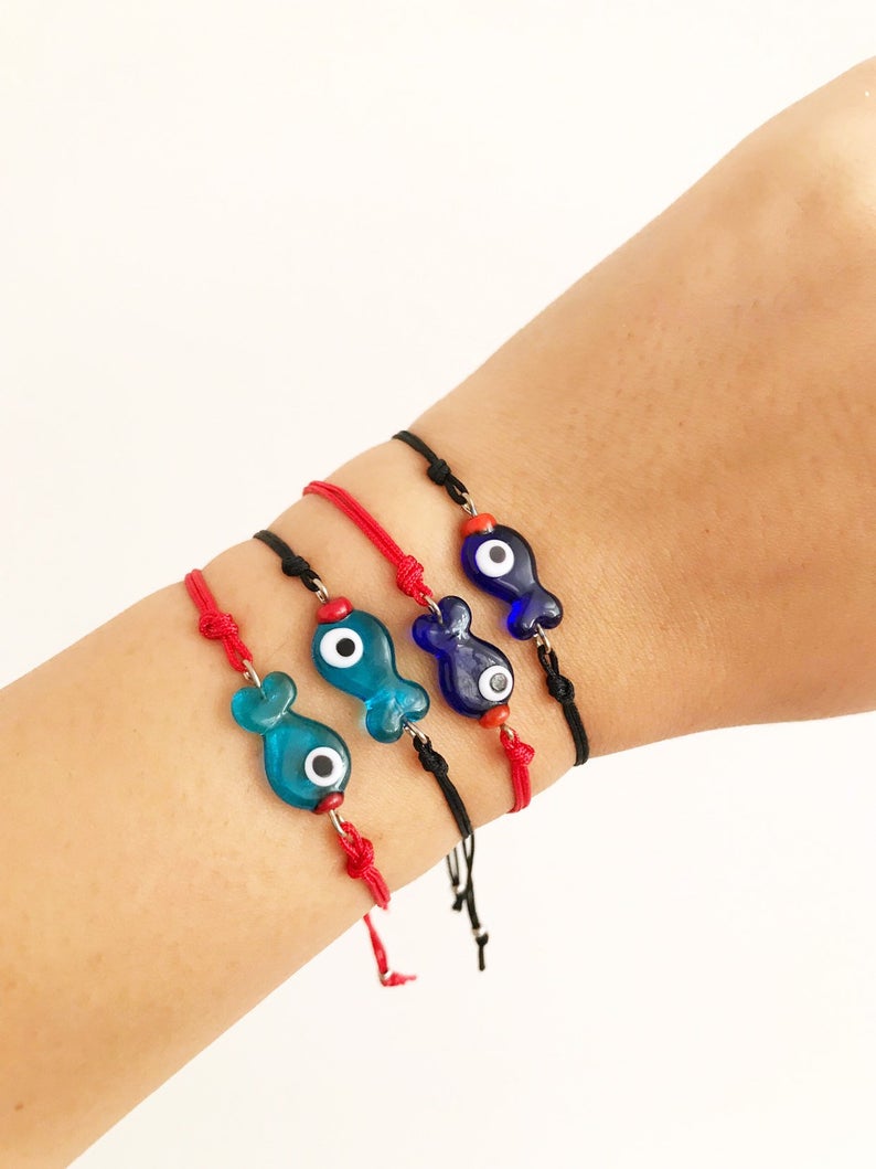 Handmade Thread Evil Eye Bracelet featuring Murano glass fish charm in turquoise and blue colors, adjustable thread design.