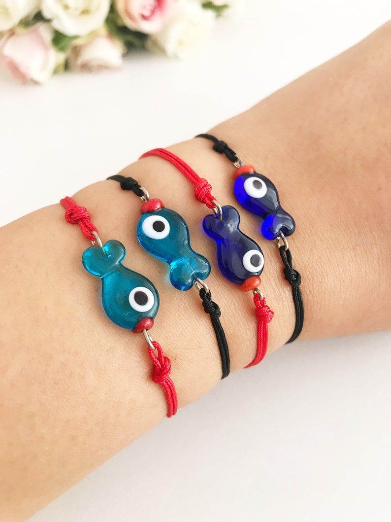 Handmade Thread Evil Eye Bracelet featuring Murano glass fish charm in turquoise and blue colors, adjustable thread design.