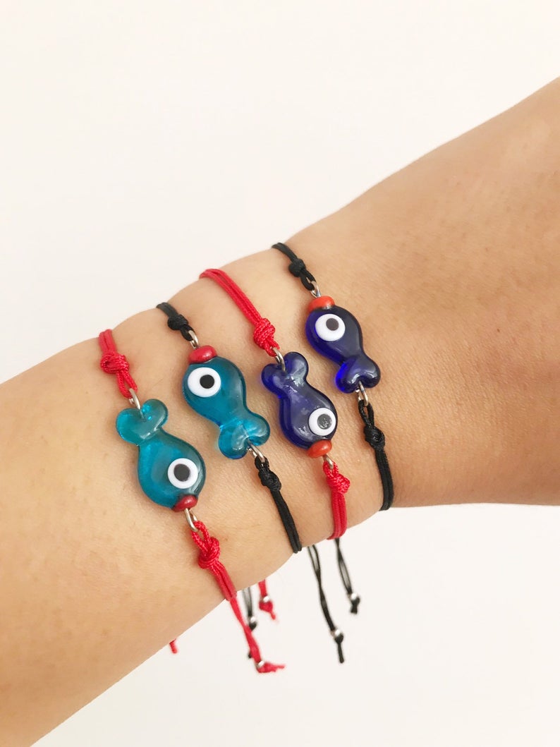 Handmade Thread Evil Eye Bracelet featuring Murano glass fish charm in turquoise and blue colors, adjustable thread design.