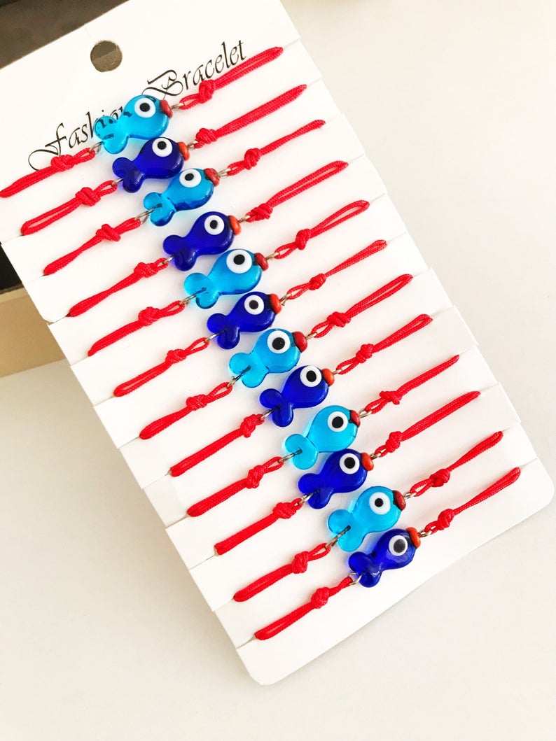 Handmade Thread Evil Eye Bracelet featuring Murano glass fish charm in turquoise and blue colors, adjustable thread design.