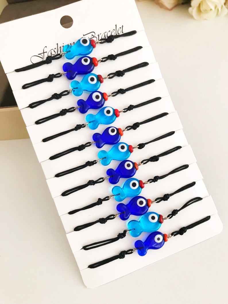 Handmade Thread Evil Eye Bracelet featuring Murano glass fish charm in turquoise and blue colors, adjustable thread design.