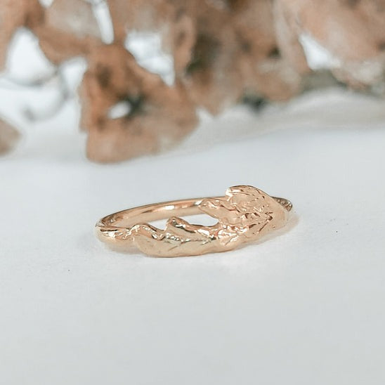 Thuja Ring featuring a stylish cedar design, plated in 18k yellow gold, adjustable for a perfect fit.